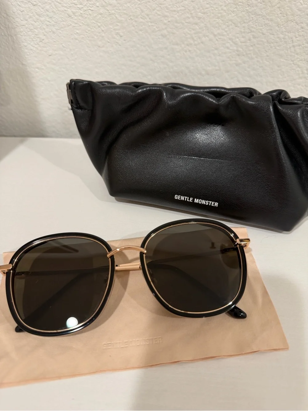 GENTLE MONSTER Black and Gold Round Sunglasses